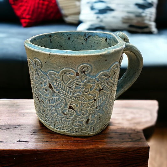 Pottery Mug with Intricate Designs