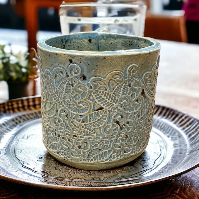 Pottery Mug with Intricate Designs