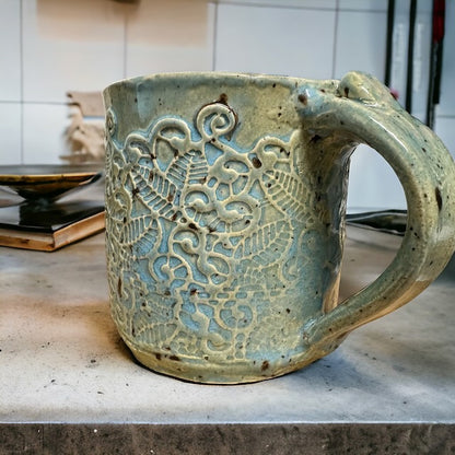 Pottery Mug with Intricate Designs