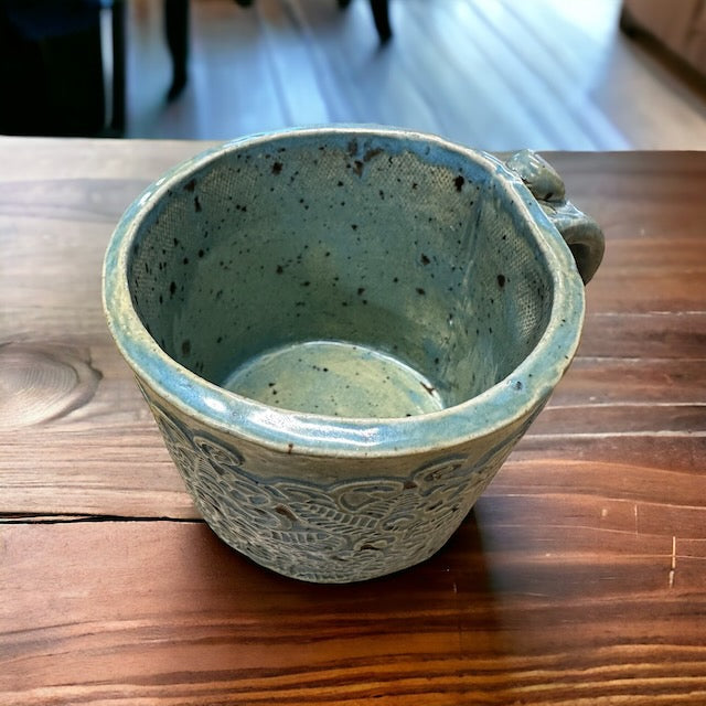 Pottery Mug with Intricate Designs